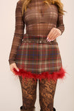 Gonna tartan con piume
