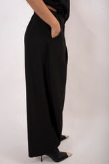 Pantalone bottone asimmetrico
